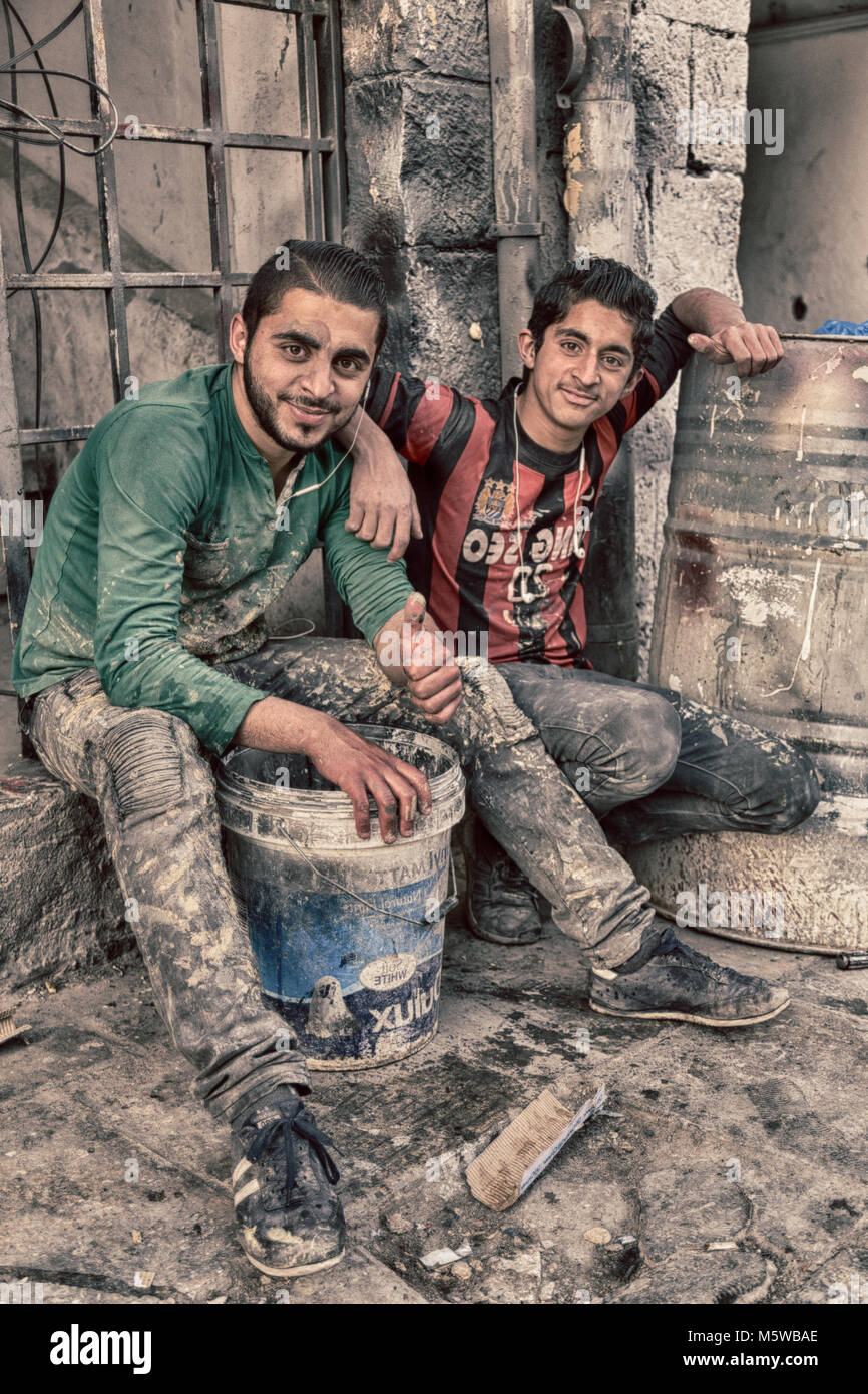 AMMAN,jORDAN-CIRCA  APRIL 2018--unidentified  young  bricklayers in the workplace Stock Photo