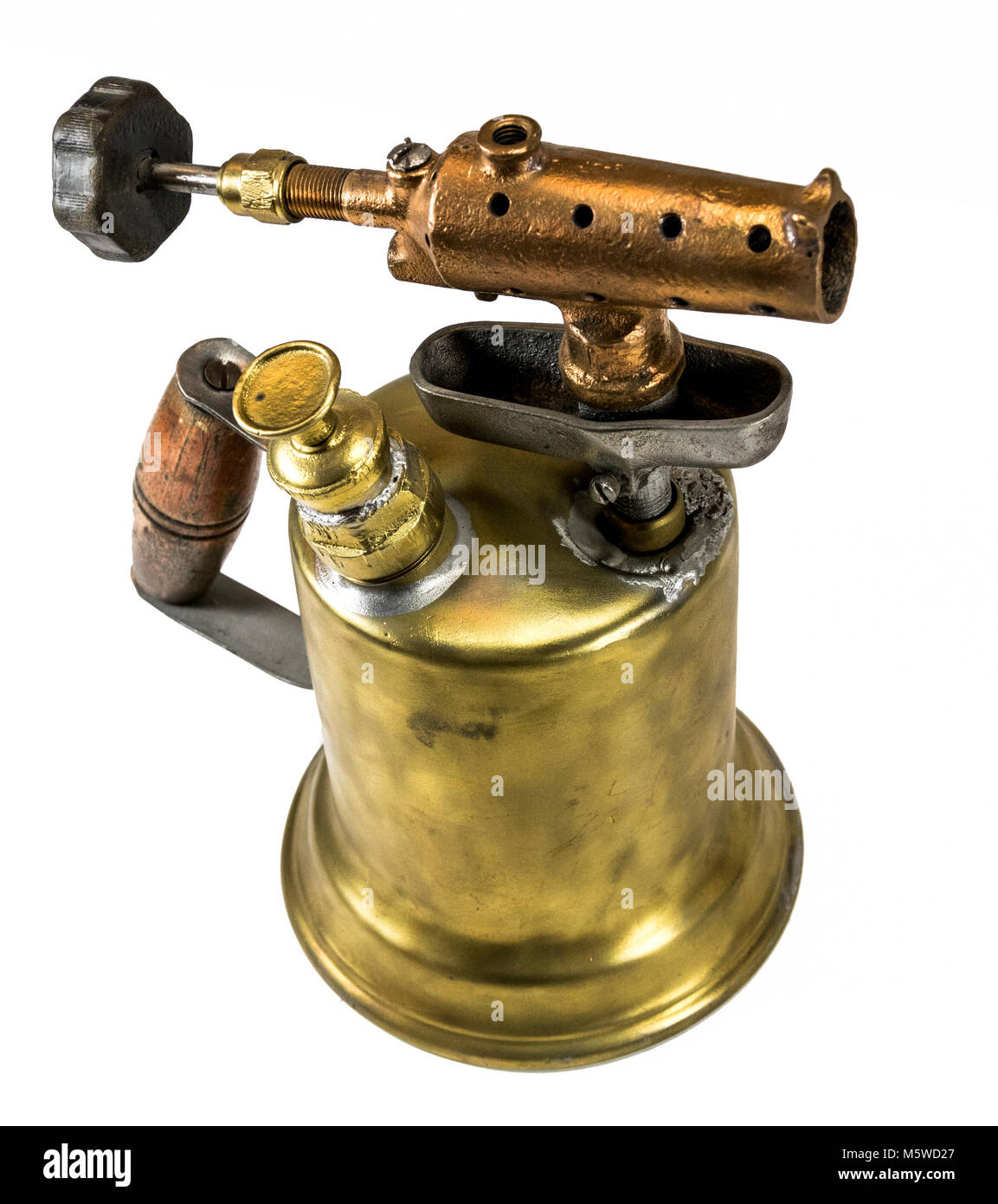 Old fashioned brass blow torch with wooden handle and bronze nozzle Stock Photo