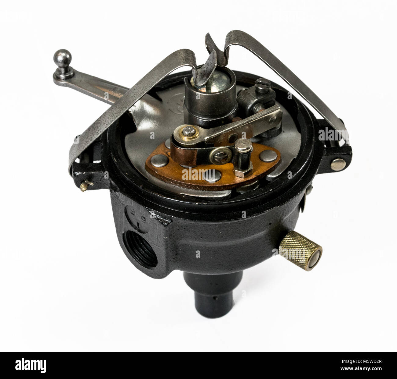 Antique automotive ignition distributor with cap bails and point set