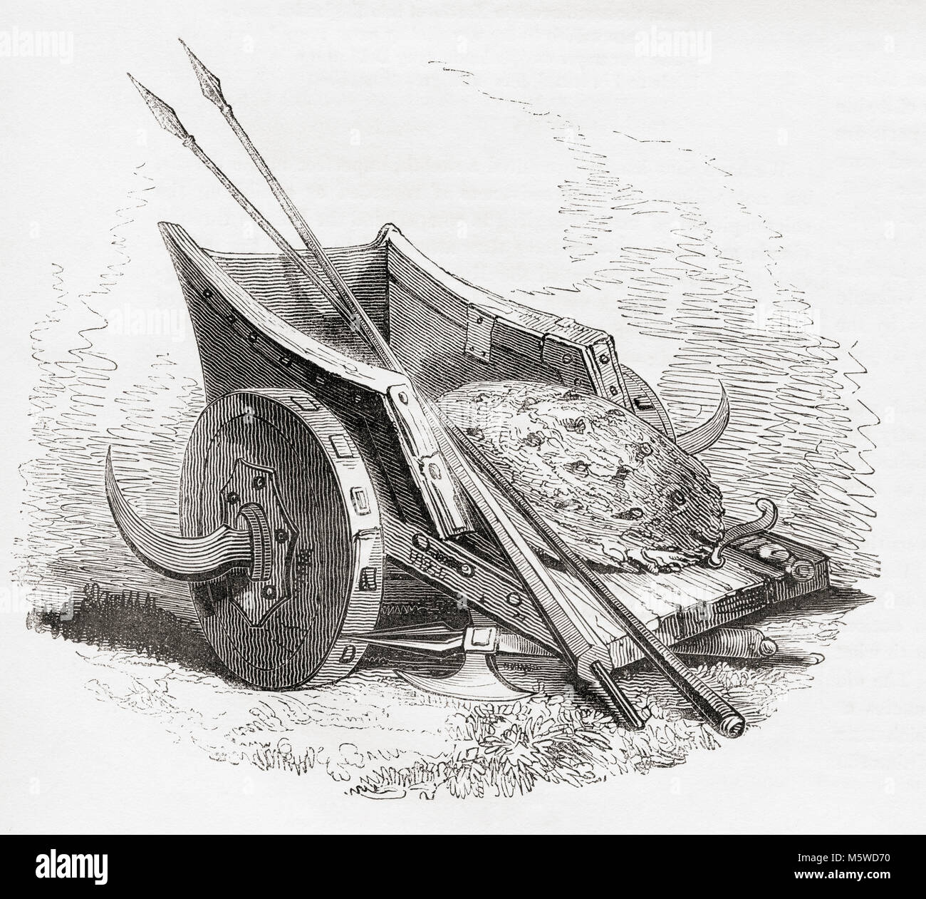 Ancient British war chariot with scythed blades coming out from the wheels.  Shield and spears resting on top.  From Old England: A Pictorial Museum, published 1847. Stock Photo