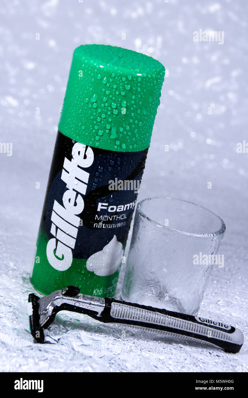 a gillette foamy menthol and razors with white, wet background Stock Photo