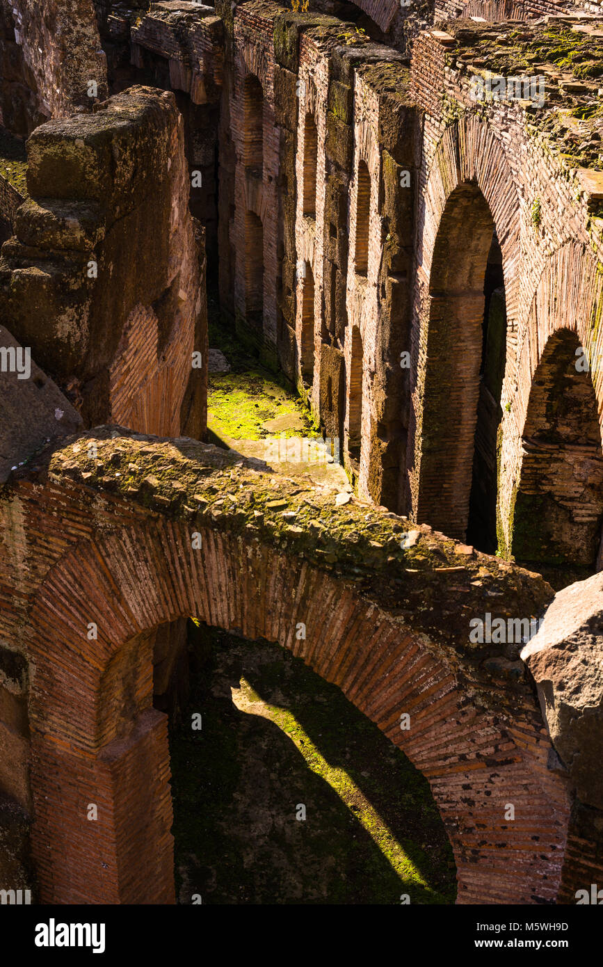 Interior closeup detail of he Colosseum or Coliseum, also known as the Flavian Amphitheatre, with the below ground level hypogeum, Rome. Lazio. Italy. Stock Photo