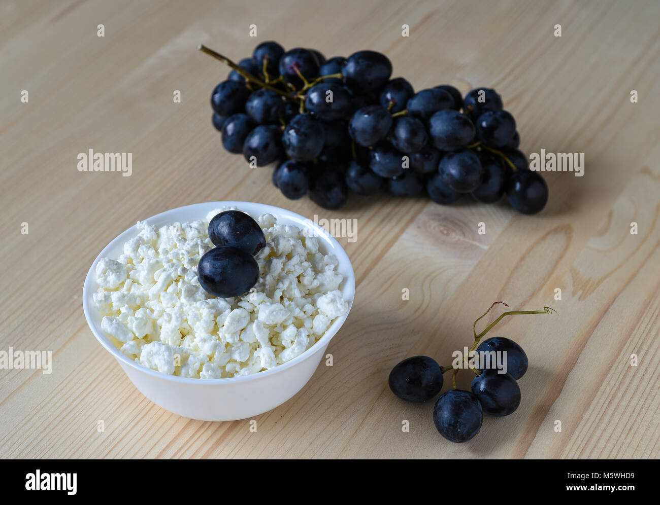 Cottage cheese with grapes Stock Photo Alamy