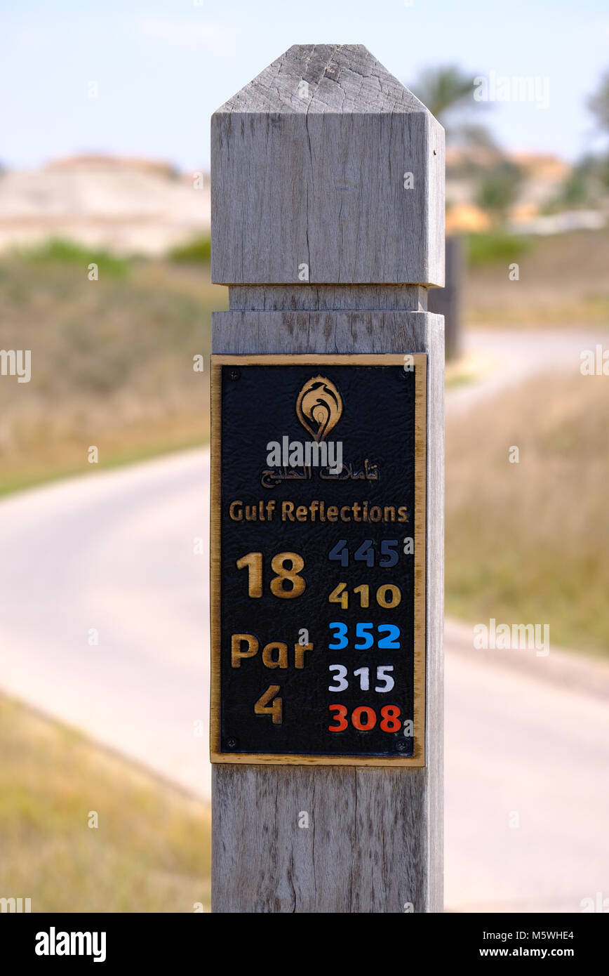 Golf Course Layout Stats engraved on wooden pole- Saadiyat Island Golf Course Stock Photo
