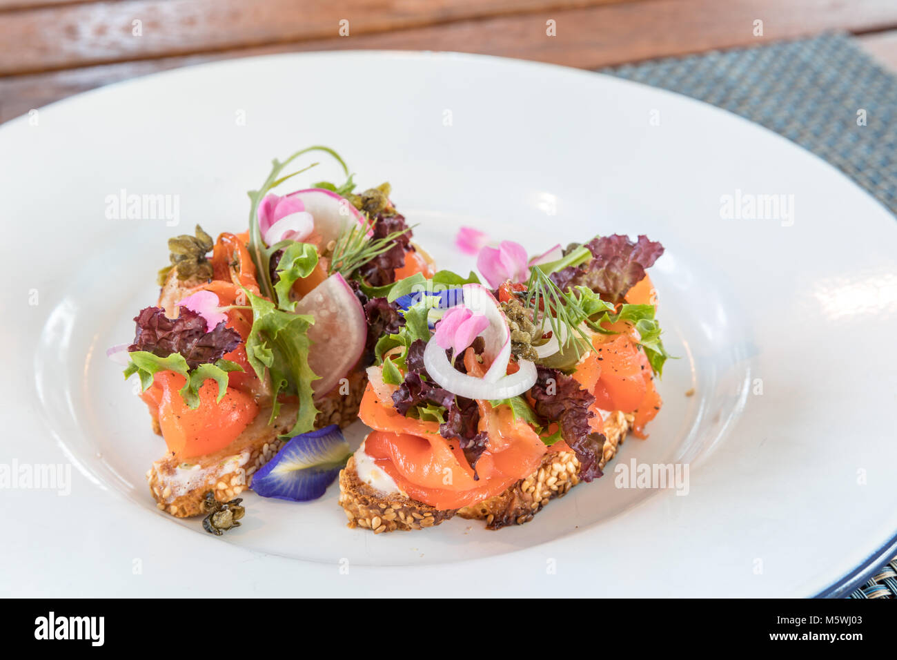 Canapes with smoked salmon and vegetable Stock Photo