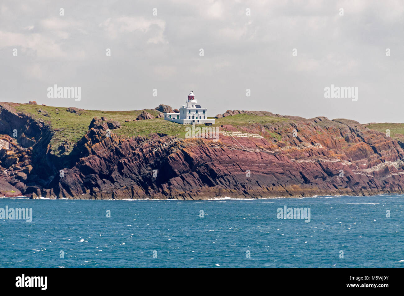 St. Ann's lighthouse on St Ann's Head, an island on the main sea approaches of the Irish Sea into Milford Haven near Pembroke in west Wales,  Britain Stock Photo