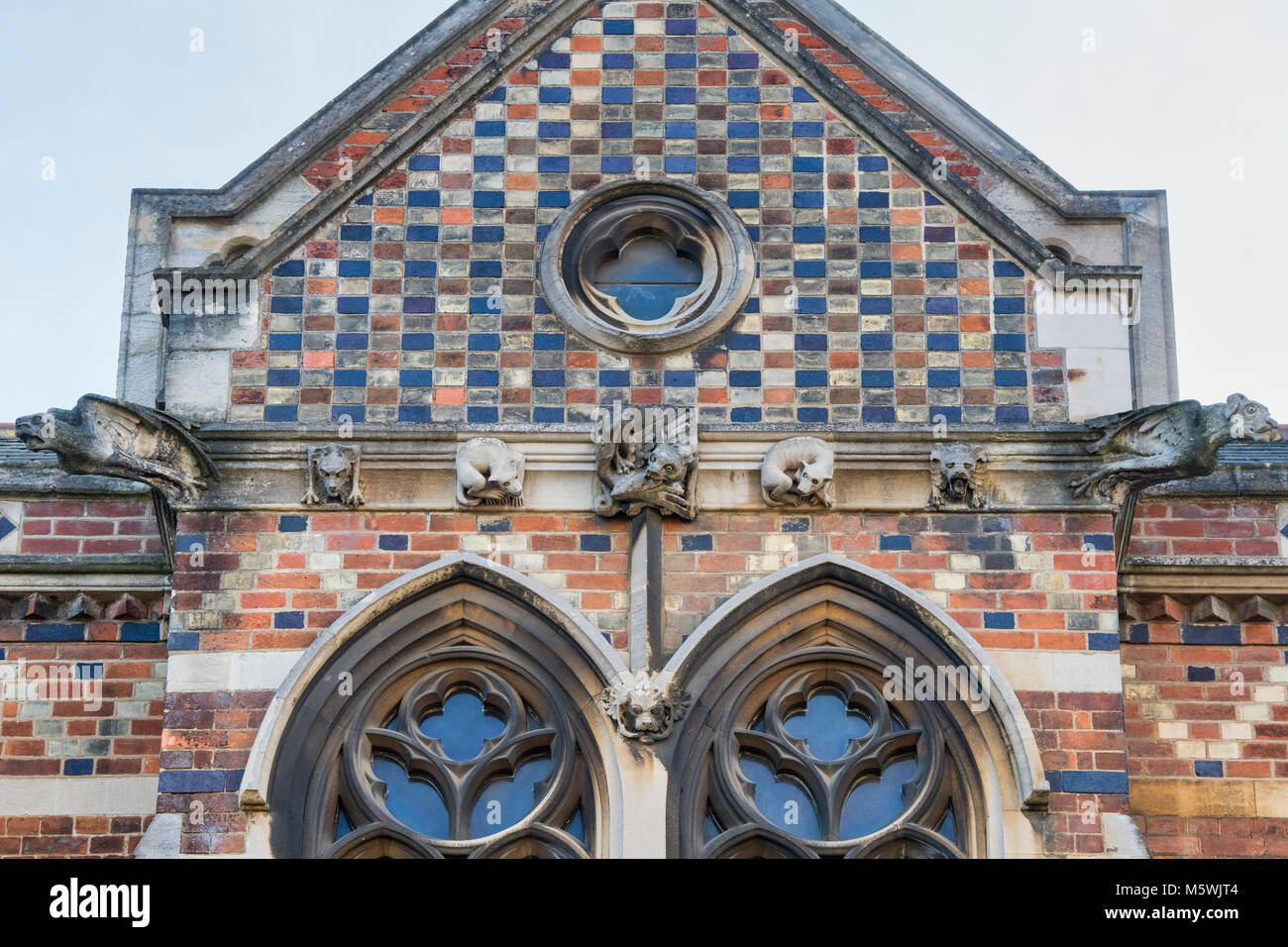 Carved stone gargoyles / grotesques on Keble college building. Oxford, Oxfordshire, England Stock Photo