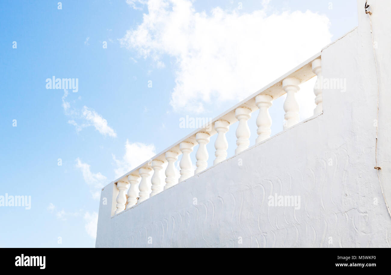 Low angle shot of a classical white stone balustrade on a roof top in Lanzarote, Spain Stock Photo