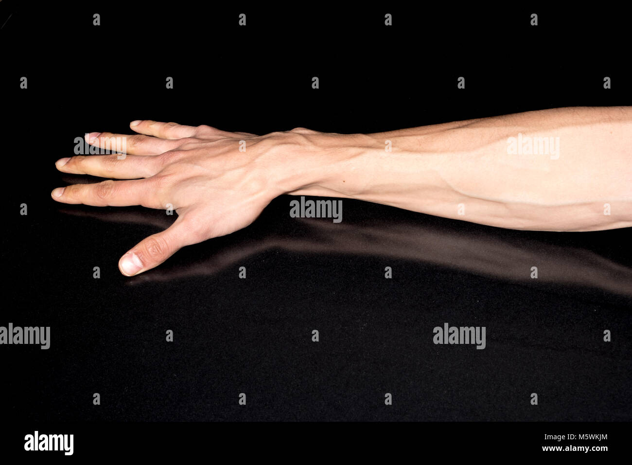 Man hand isolated on black background Stock Photo