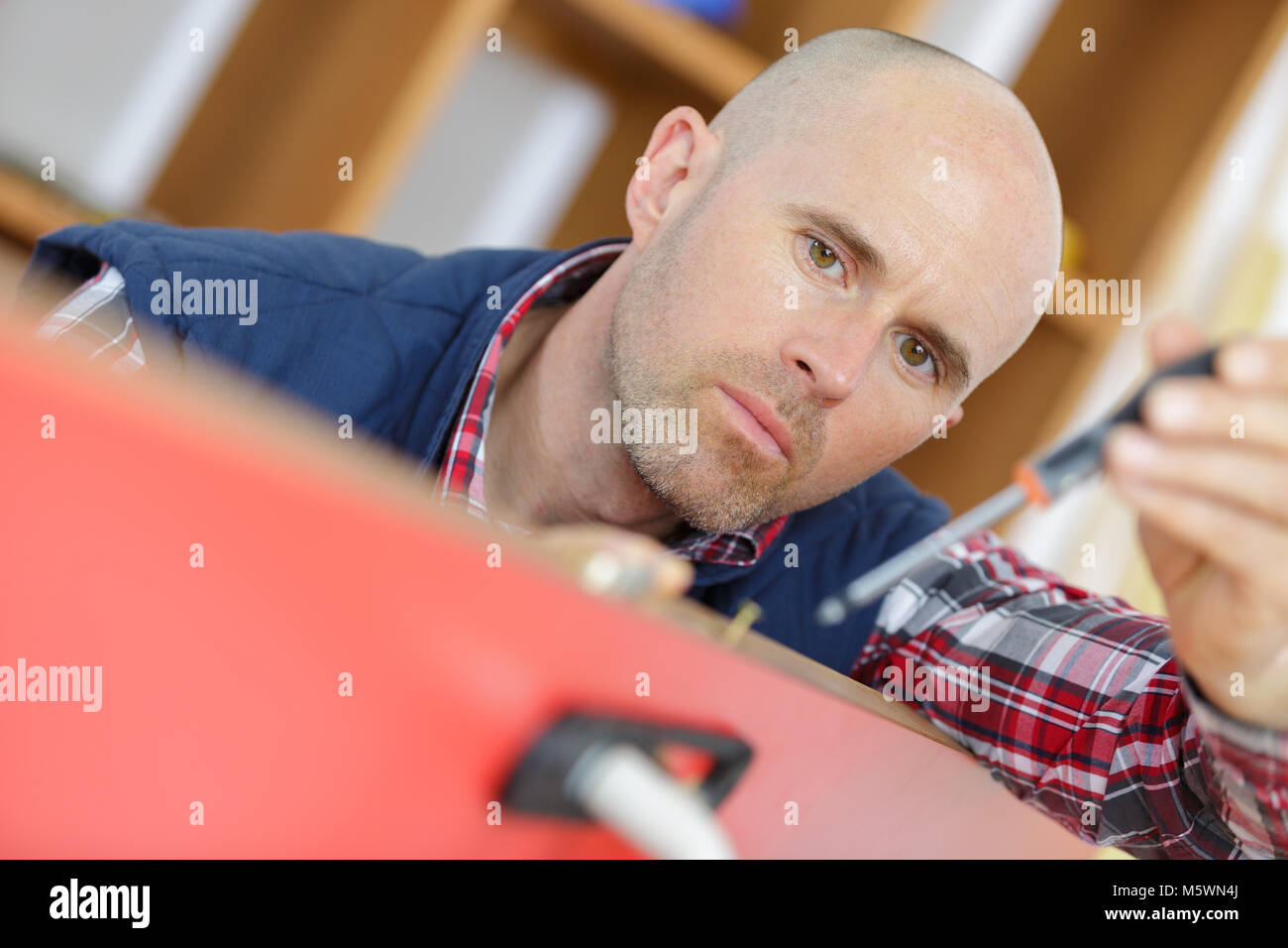 professional locksmith installing or repairing a new deadbolt lock