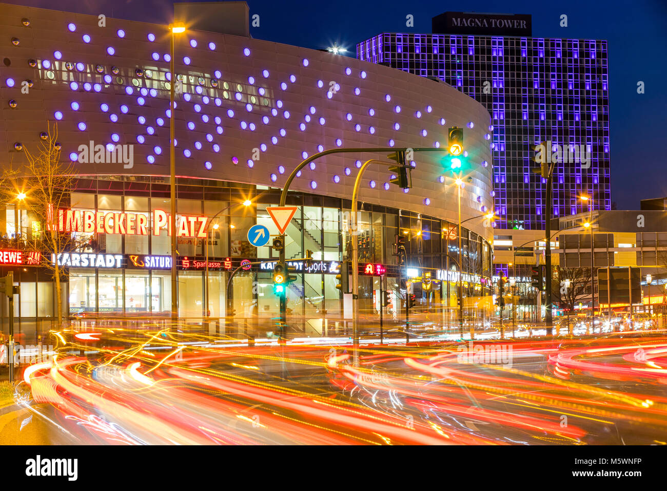 Berliner Platz, square, in the city center of Essen, Germany, Limbecker Platz shopping center, Magna Tower office building, evening traffic, Stock Photo