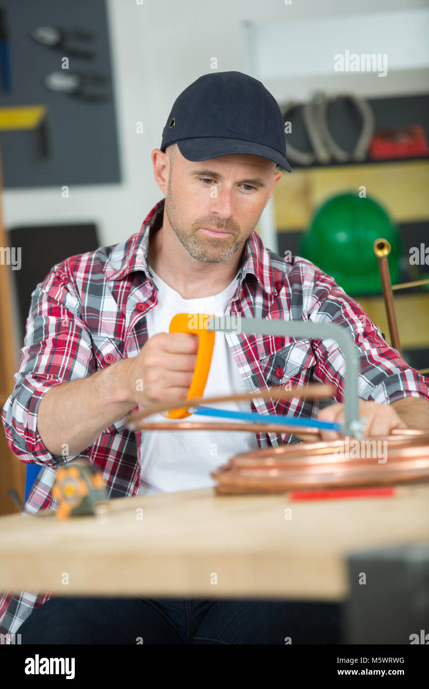 hand saw cutting wood board Stock Photo Alamy