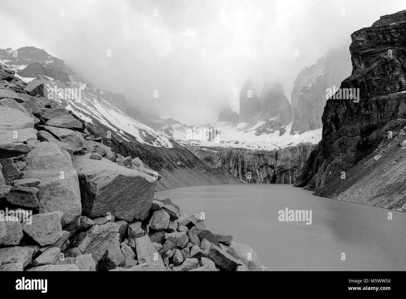 Black & white pre dawn misty view of Torres del Paine; Torre Central; Torre Norte; Monzino; Cordillera del Paine; Torres del Paine Nat'l. Park; Chile Stock Photo