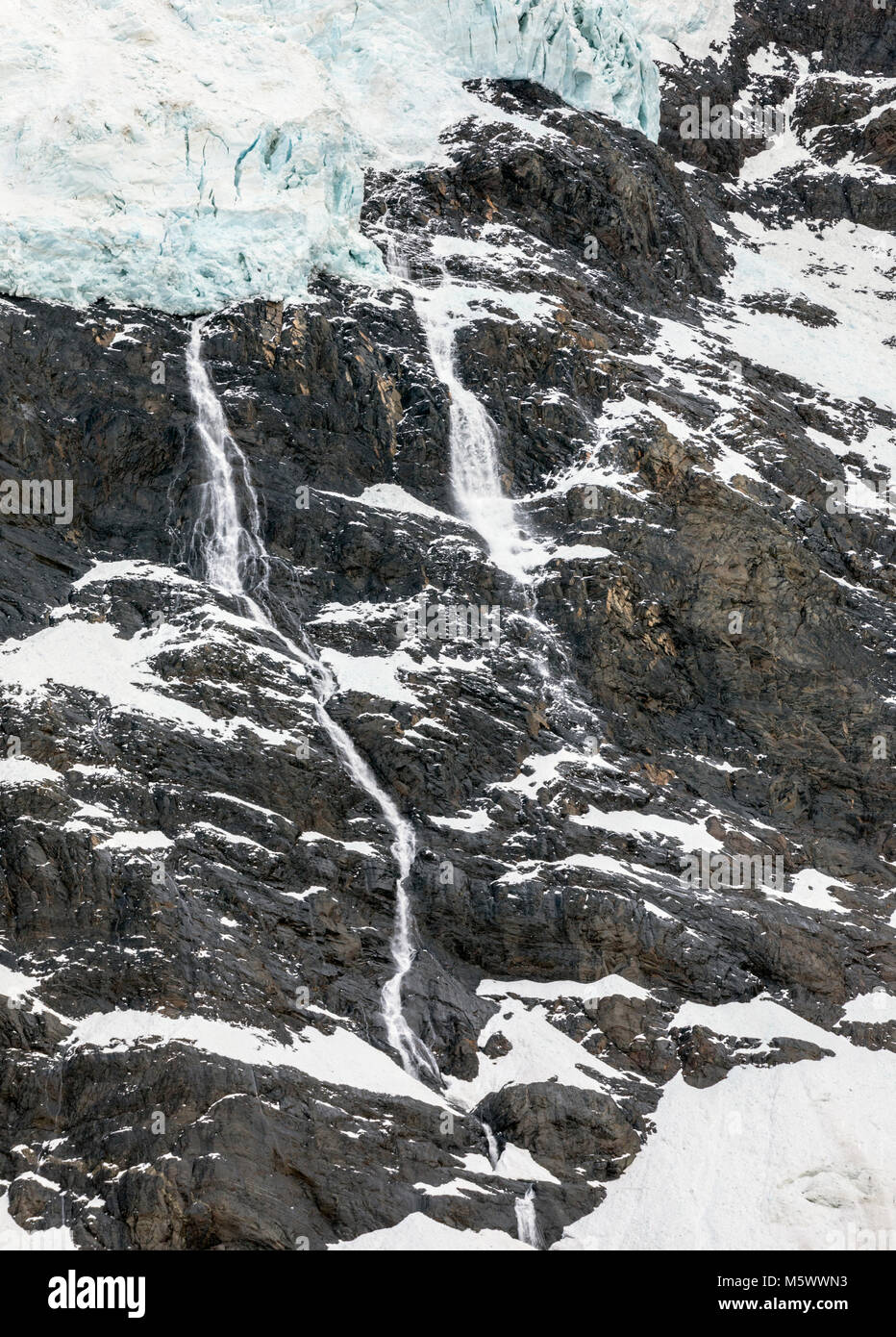 Waterfalls from snow melt; face of Glaciar Frances; Torres del Paine National Park; Chile Stock Photo