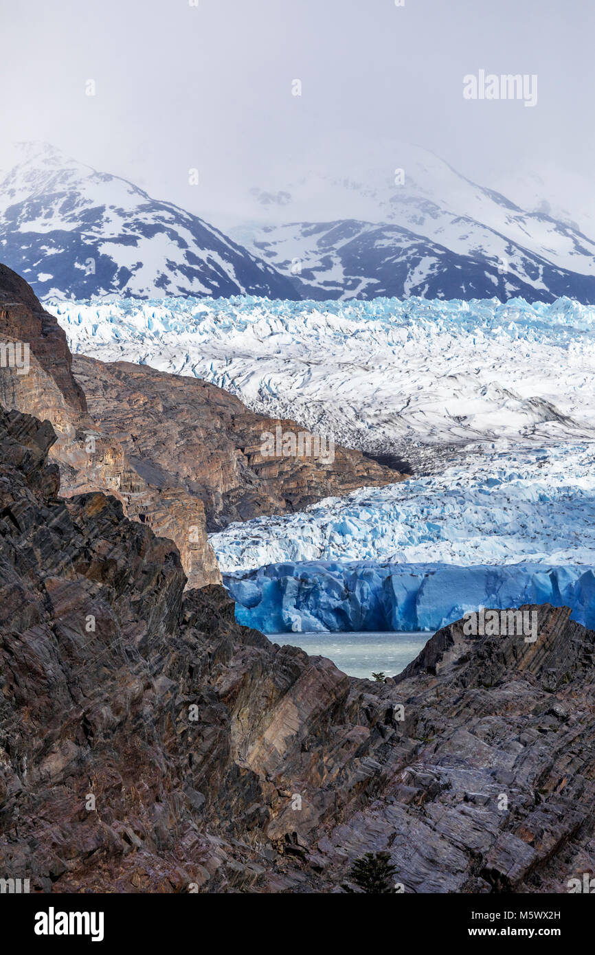 Rugged face of Glaciar Grey melts and calves into Lago Grey; Torres del Paine National Park; Chile Stock Photo
