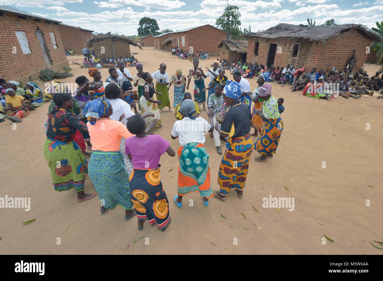 Women sing and dance in Kalikumbi, Malawi, part of an educational program promoting good health. Stock Photo