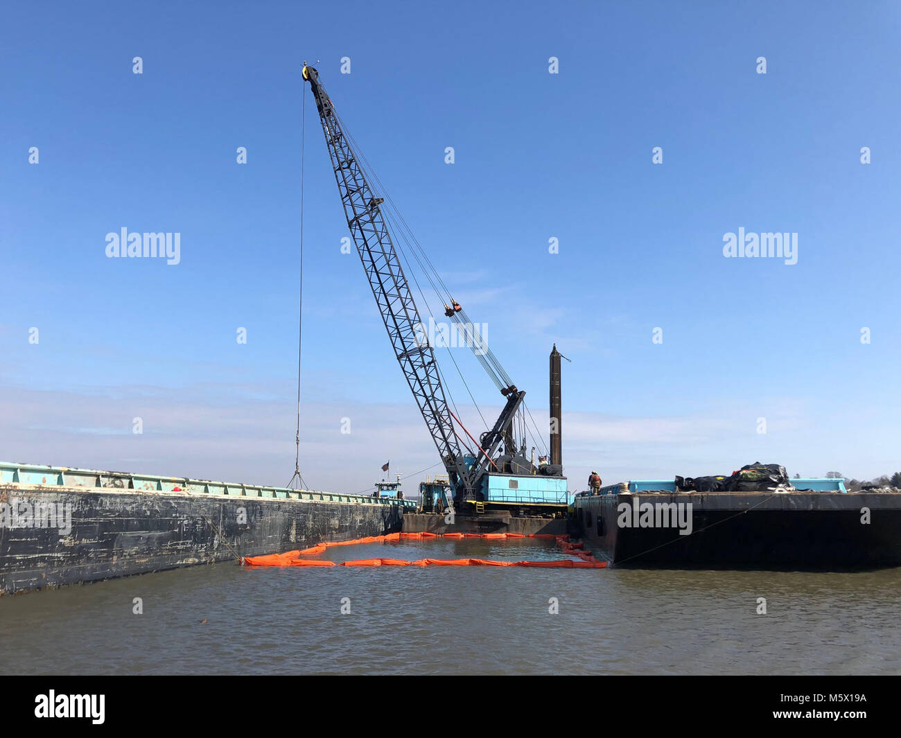 A dredge excavates material from the North Cove Federal Navigation project in Old Saybrook, Connecticut.    Photo by Craig Martin/U.S. Army Corps of Engineers, New England District. Stock Photo