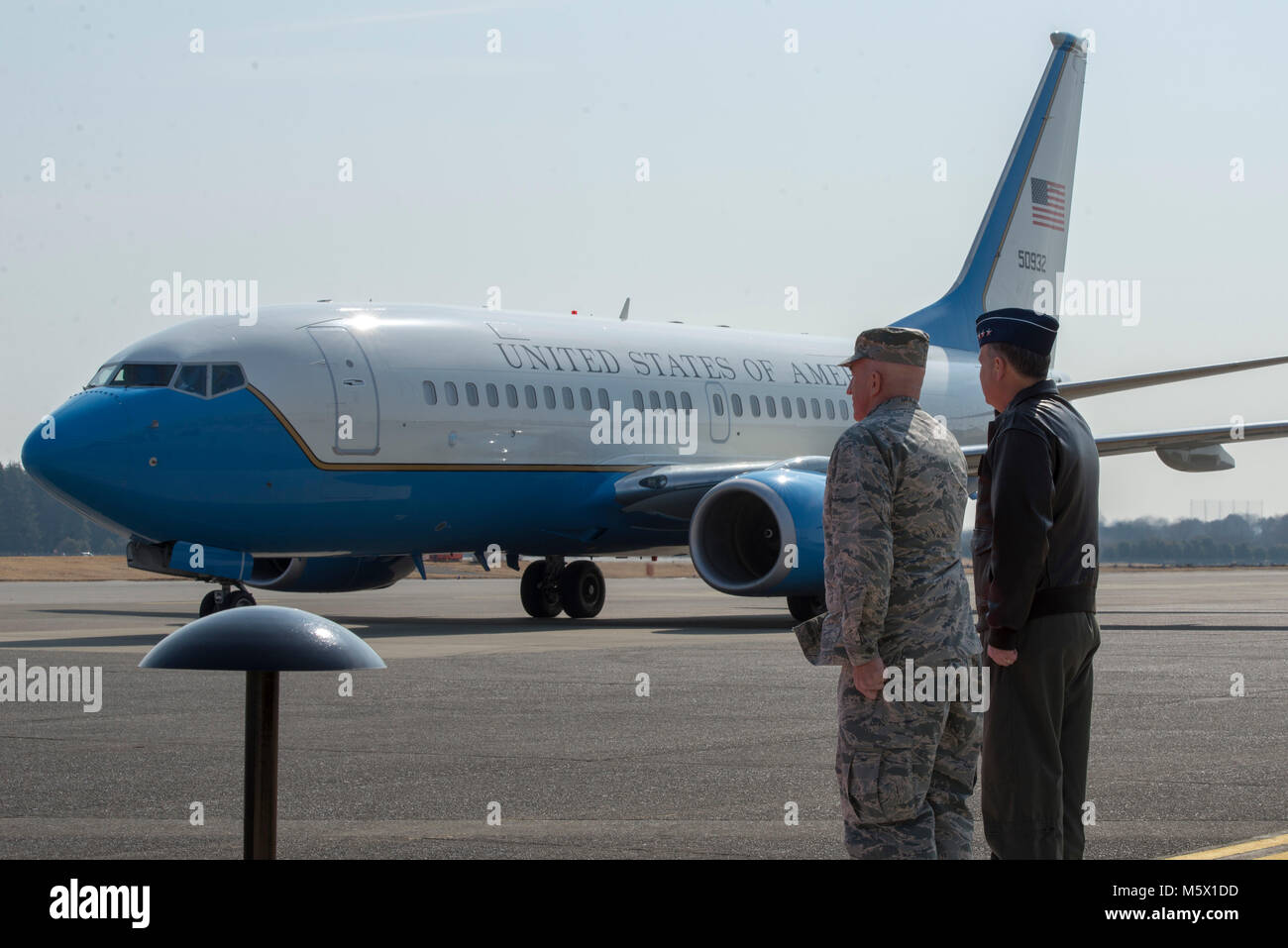 Lt. Gen. Jerry P. Martinez, United States Forces Japan and 5th Air Force commander, and Col. Kenneth E. Moss, 374th Airlift Wing commander, salute the arrival of the congressional delegation of Sen. James Inhofe, R-O.K., at Yokota Air Base, Japan, Feb. 24, 2018. The delegation composed of: Sen. Joni Ernst, R-I.A, Sen. Daniel Sullivan, R-A.K., members of the Senate Armed Services Committee, and Rep. Trent Kelly, R-M.S., member of the House Armed Services Committee, met with USFJ leadership and stressed the importance of missile defense in the region. (U.S. Air Force photo by Airman 1st Class Ma Stock Photo