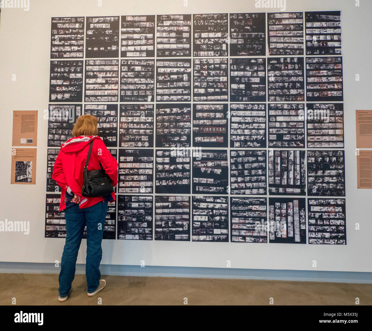 Portland, Oregon, USA. 26 FEB, 2018. Gallery goers view the enlarged contact sheets from photographer Robert Frank’s groundbreaking book 'The Americans' at Blue Sky Gallery in Portland, Oregon, USA. The work later was destroyed in a “Destruction Dance” performance defacing the photographs with ink and mutilation with scissors, knives and even ice skates  at the end of it’s run. The destruction was Frank's protest regarding today's greed in the global art market. Credit: Ken Hawkins/Alamy Live News Stock Photo