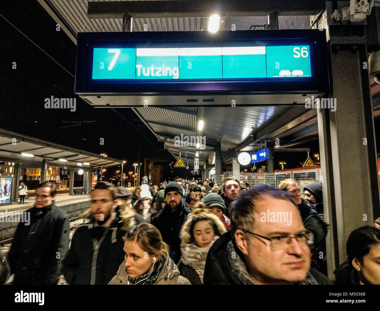 Munich, Bavaria, Germany. 26th Feb, 2018. The platform at the Pasing station, where thousands of riders hoped to find connections to get home. Due to a failed overhead powerline at Munich's Pasing train station, yet another failure of the overburdened S-Bahn train system in the city caused chaos that is persisting some 12 hours after the initial failure. Continuing on are complete shutdowns of the system as of 19:00 local time, with slow, limited, intermittent service in between. On the platforms one may seen thousands of people tryng to get home with no replacement services available. Stock Photo