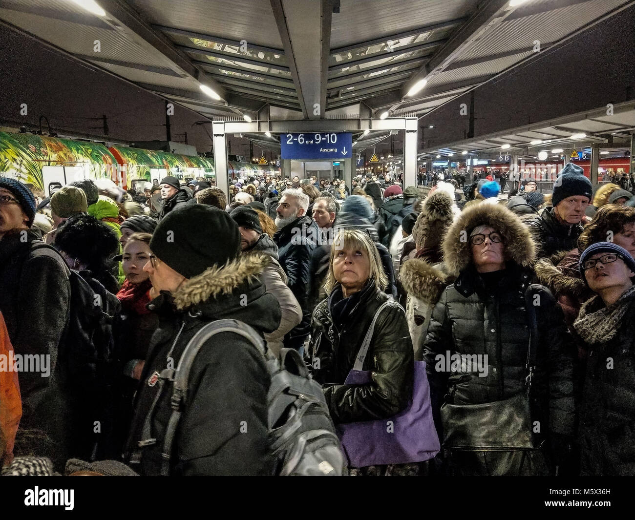 Munich, Bavaria, Germany. 26th Feb, 2018. The platform at the Pasing station, where thousands of riders hoped to find connections to get home. Due to a failed overhead powerline at Munich's Pasing train station, yet another failure of the overburdened S-Bahn train system in the city caused chaos that is persisting some 12 hours after the initial failure. Continuing on are complete shutdowns of the system as of 19:00 local time, with slow, limited, intermittent service in between. On the platforms one may seen thousands of people tryng to get home with no replacement services available. Stock Photo