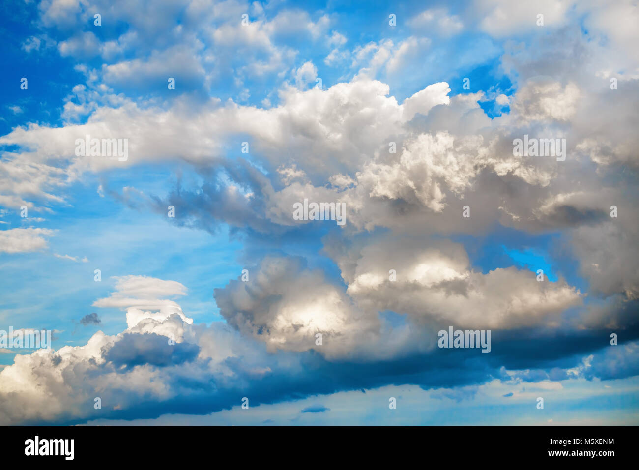 Clouds in the blue sky. Sky background with white cumulus clouds on a ...