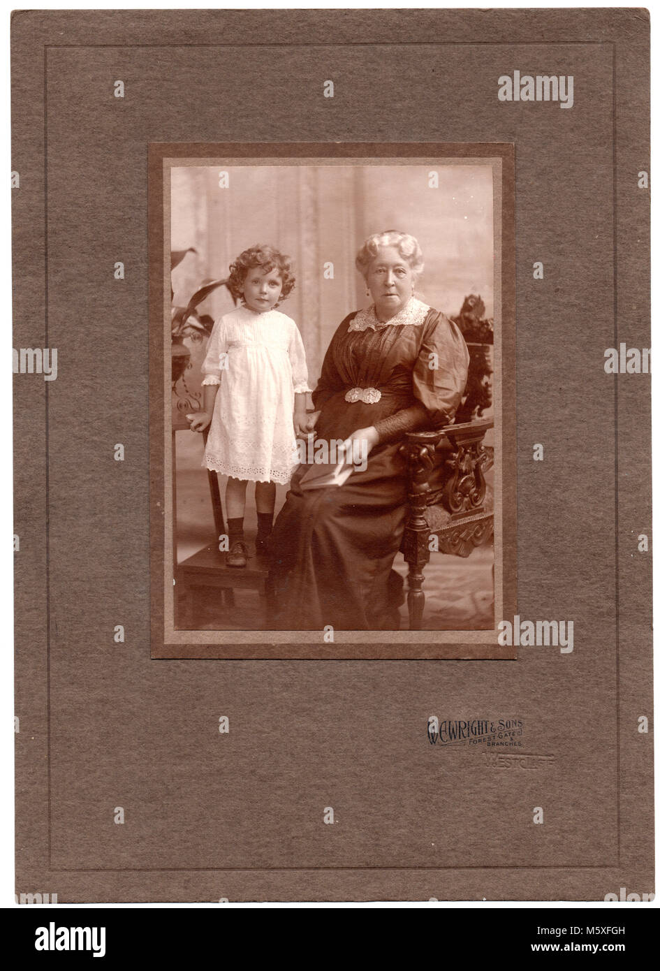 Elizabeth Perrett, née Jupp, born 5 Sept 1834, died 2 Feb 1927, and her granddaughter Margaret Perrett, born 1 June 1912, died 14 Jan 1990.  Formal studio portrait, circa 1916 Stock Photo