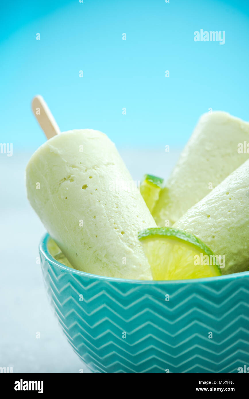 Lime and coconut milk popsicles. Stock Photo