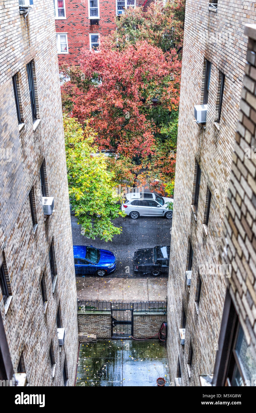Residential apartment building and street road with sidewalk between in