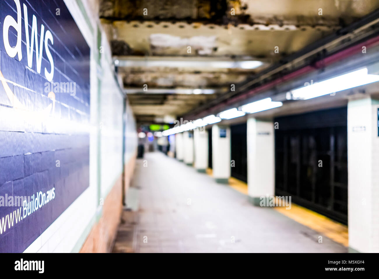 New York City, USA - October 30, 2017: Amazon Web Services AWS advertisement ad sign closeup in underground transit platform in NYC Subway Station, wa Stock Photo