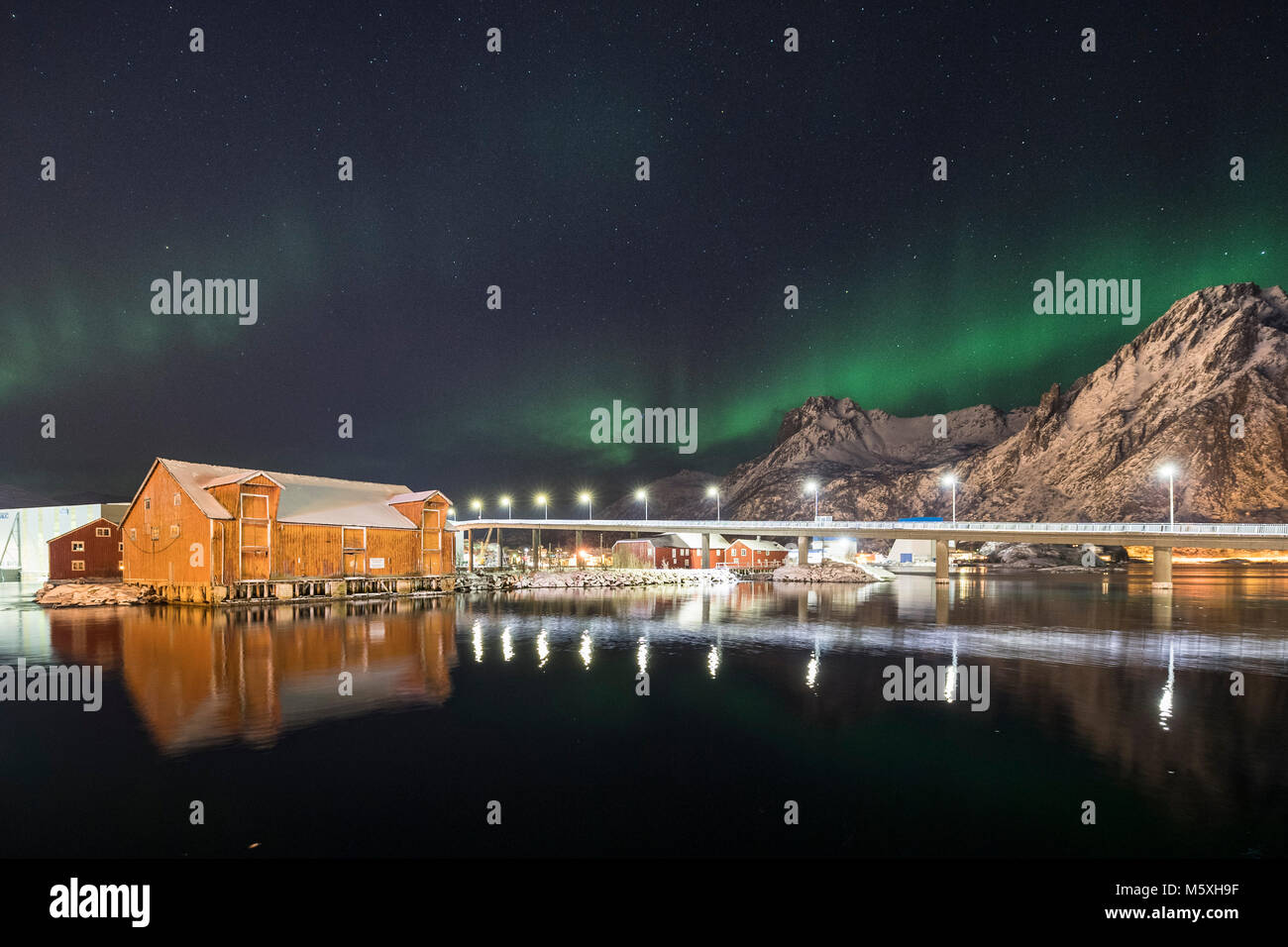 Northern lights, Aurora Borealis over Svolvaer, townscape, harbour with illuminated bridge, Svolvaer, Austvågøy, Lofoten Stock Photo