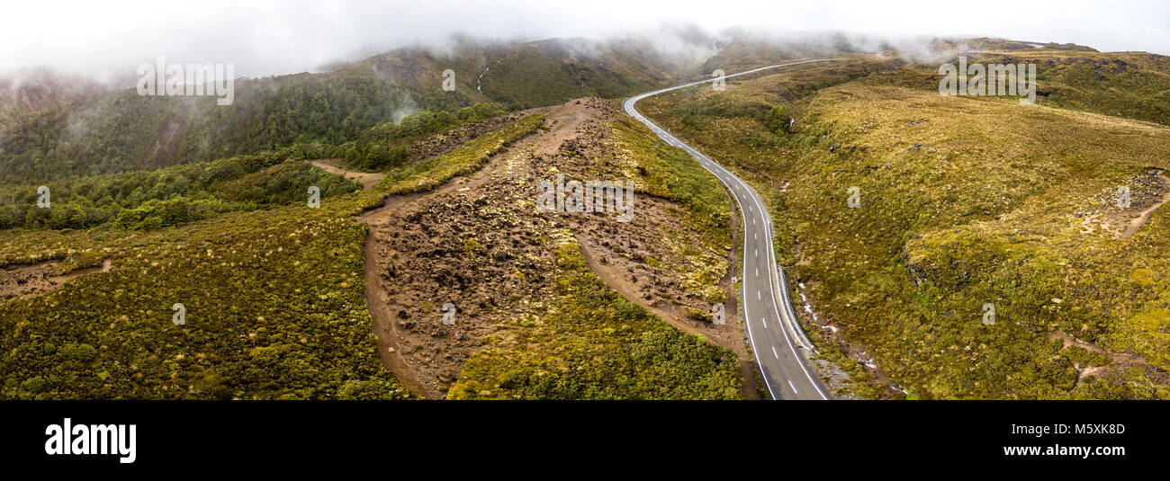 Aerial Panorama of windy road through volcanic landscape Stock Photo