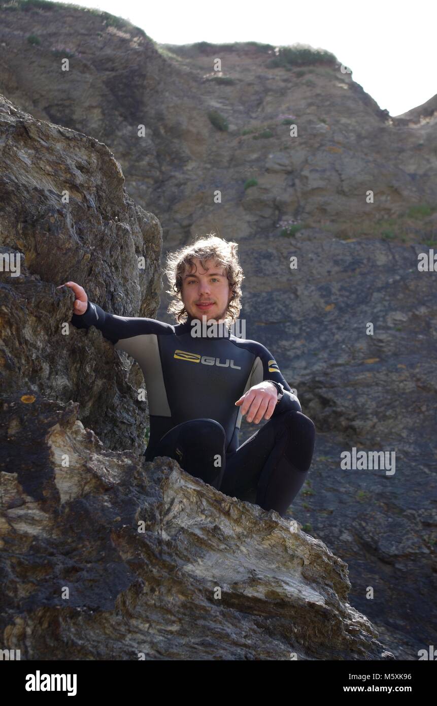 Young, Ruggedly Handsome British Surfer, in a Wetsuit on Holywell Beach