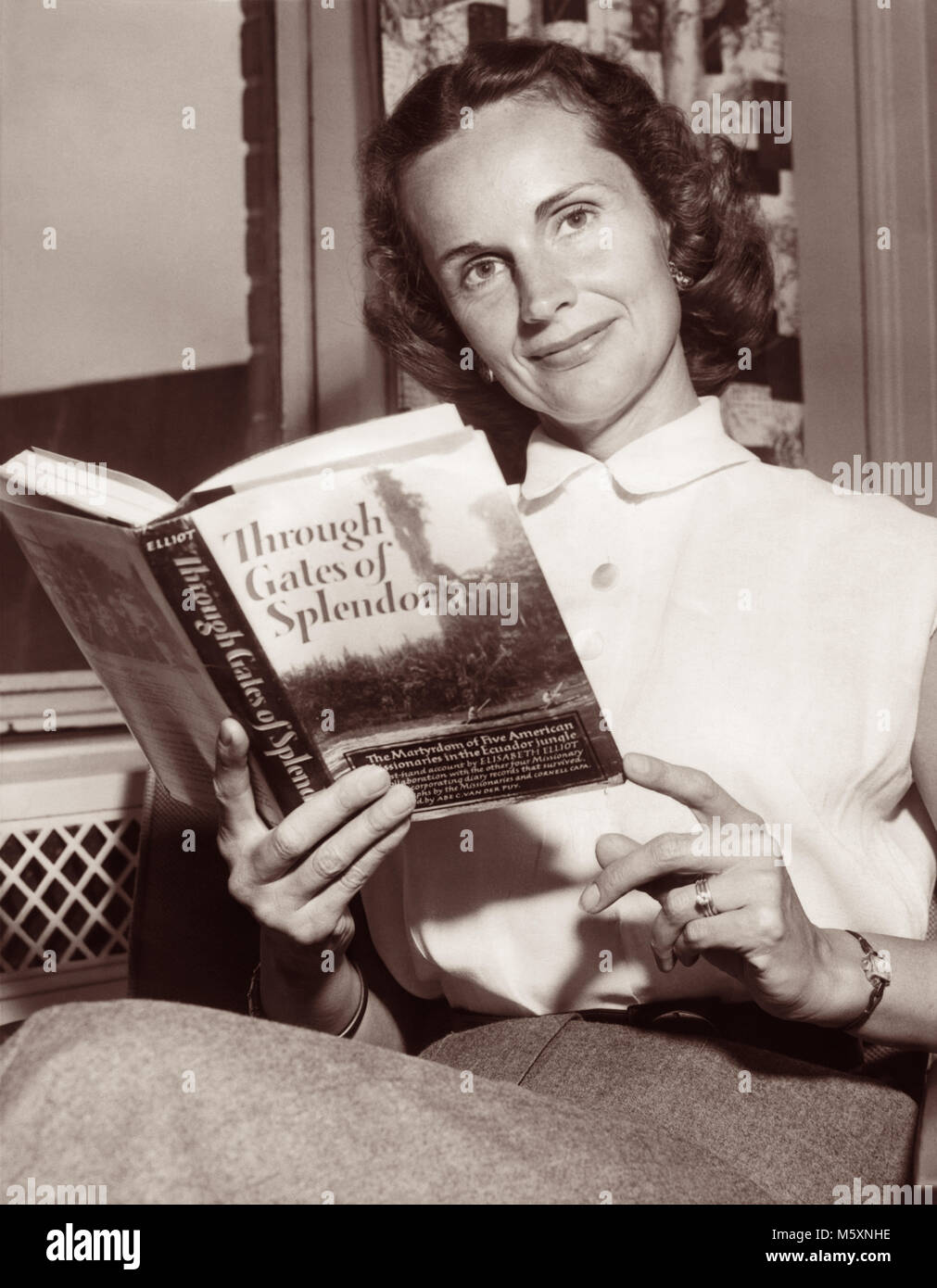 Ruth Bell Graham (1920-2007), wife of American evangelist Billy Graham, reading missionary Elisabeth Elliot's book Through Gates of Splendor in 1957 during visit to New York City for Billy Graham's crusade at Madison Square Gardens. Stock Photo