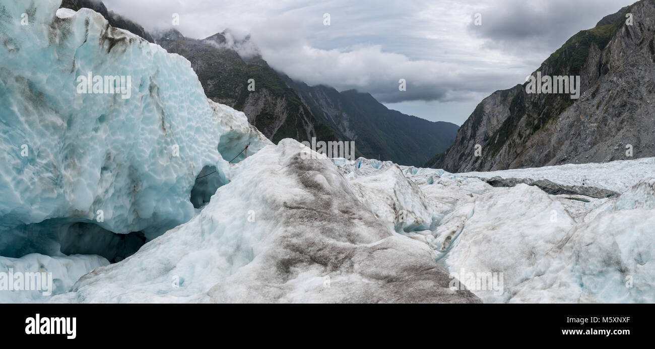 Hiking on ice through a glacier Stock Photo