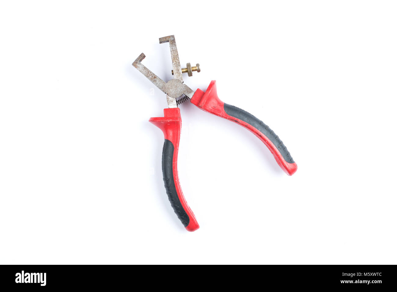 Pliers for removing isolation from electrical cables with red handles isolated on a white background. Electrician tool Stock Photo