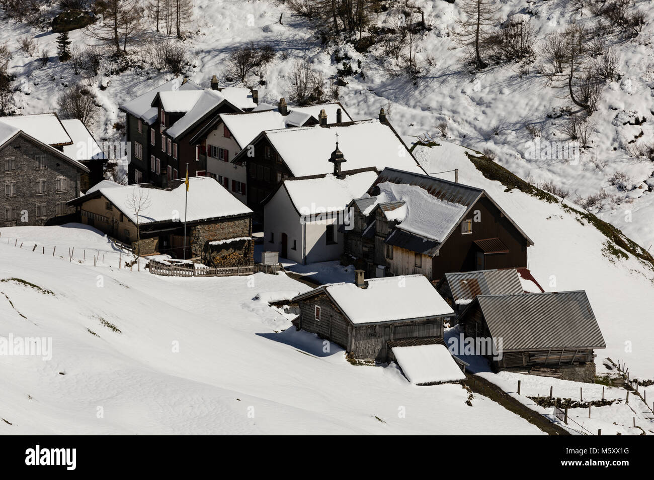 Old traditional village in winter in the Meiental valley in central Switzerland Stock Photo