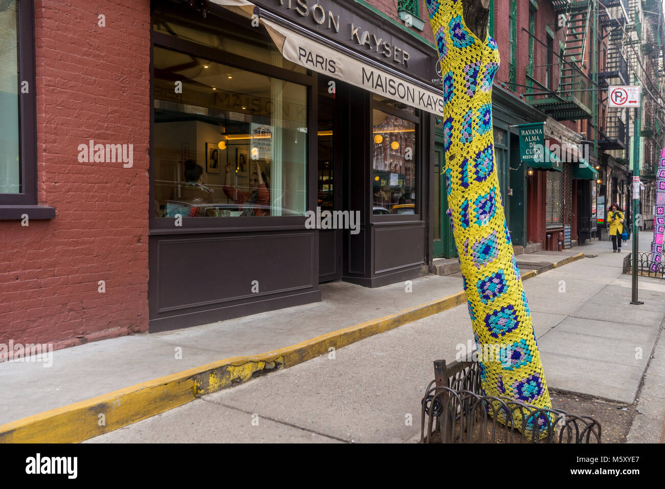 New York, NY, USA, 26 Feb 2018 - Beginning in November, shop keeper Holly Boardman, owner of local lingerie store Musèe Lingerie, began swaddling the trees in yarn. All in all, she used 1500 of yarn to cover the trees on Christopher Street in the West Village. The Parks Department has since given her until March to remove the chocheted covers for fear they could damage the trees. ©Stacy Walsh Rosenstock/Alamy Stock Photo