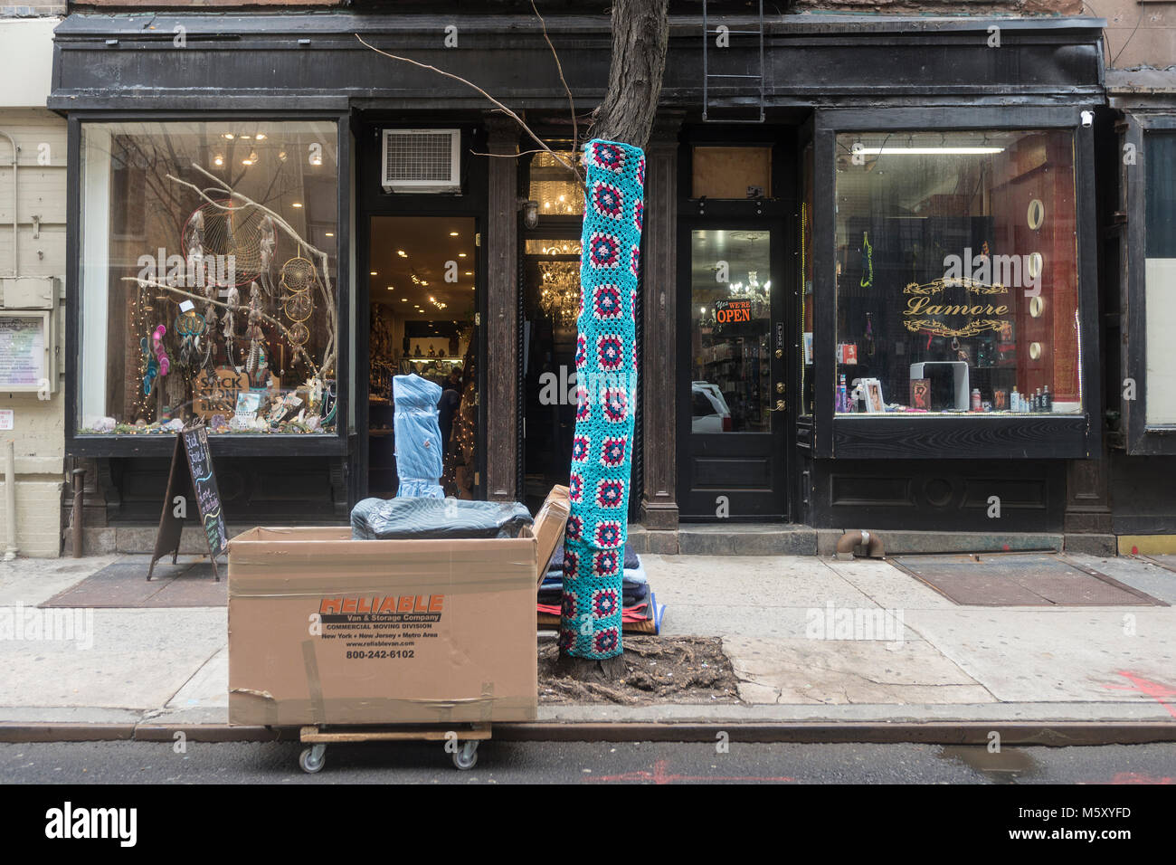 New York, NY, USA, 26 Feb 2018 - Beginning in November, shop keeper Holly Boardman, owner of local lingerie store Musèe Lingerie, began swaddling the trees in yarn. All in all, she used 1500 squares of yarn to cover the trees on Christopher Street in the West Village. The Parks Department has since given her until March to remove the chocheted covers for fear they could damage the trees. ©Stacy Walsh Rosenstock/Alamy Stock Photo