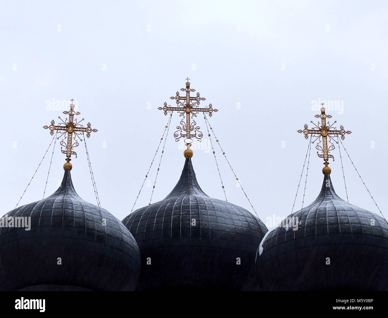 Three big domes on top of the christian church on the white background Stock Photo