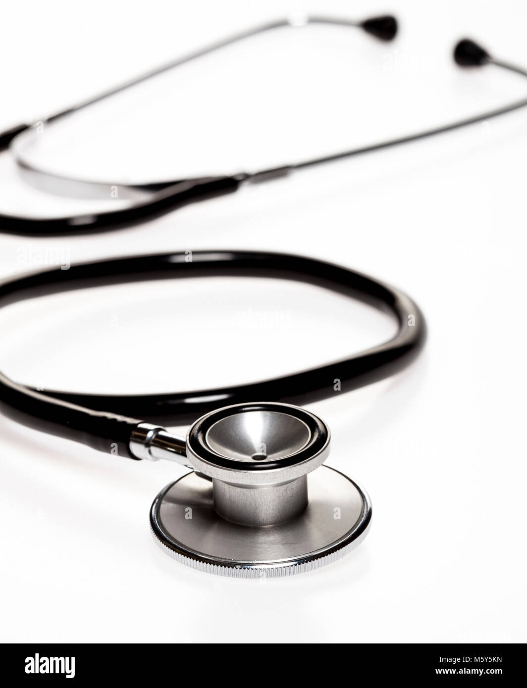 Stethoscope in the shape of heart beat on white background Stock Photo ...