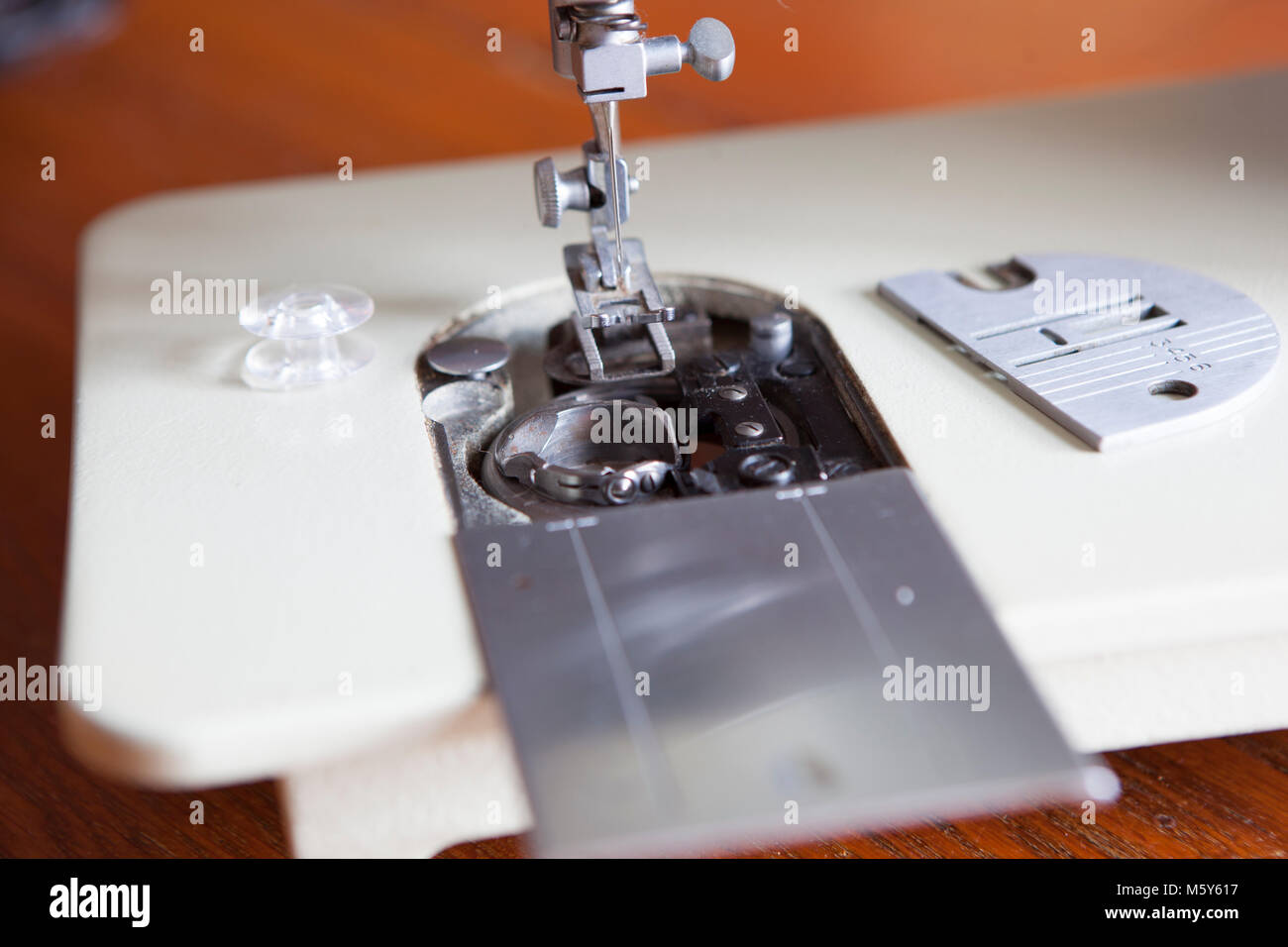 Sewing Machine Needle and Feed Dogs Closeup Stock Photo