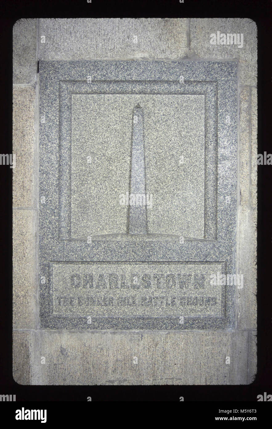 Charlestown, Massachusetts Level: 170-ft. Donor: Charlestown, Massachusetts Dates: 1854/1885 Original material: granite Dimensions: 4' 5 x 3' 3  Sculptor/Carver: not known Original inscription: Charlestown The Bunker Hill Battle Ground Stock Photo