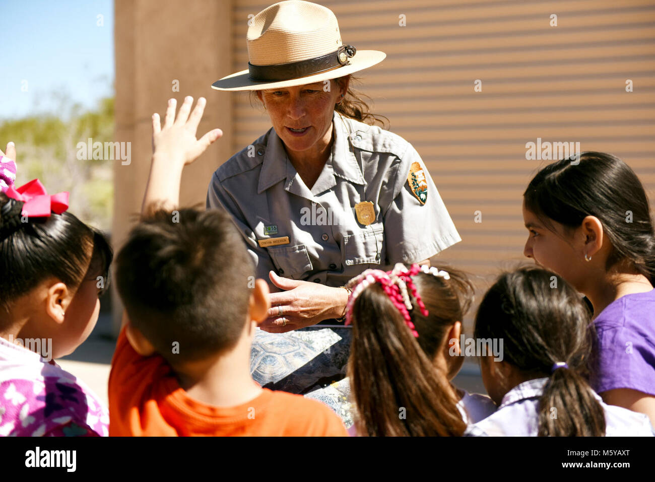 Ranger talking to students Stock Photo - Alamy