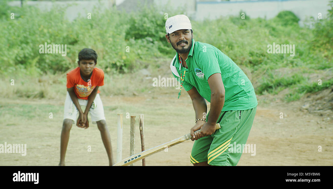 Village rural Indian boys playing cricket Stock Photo