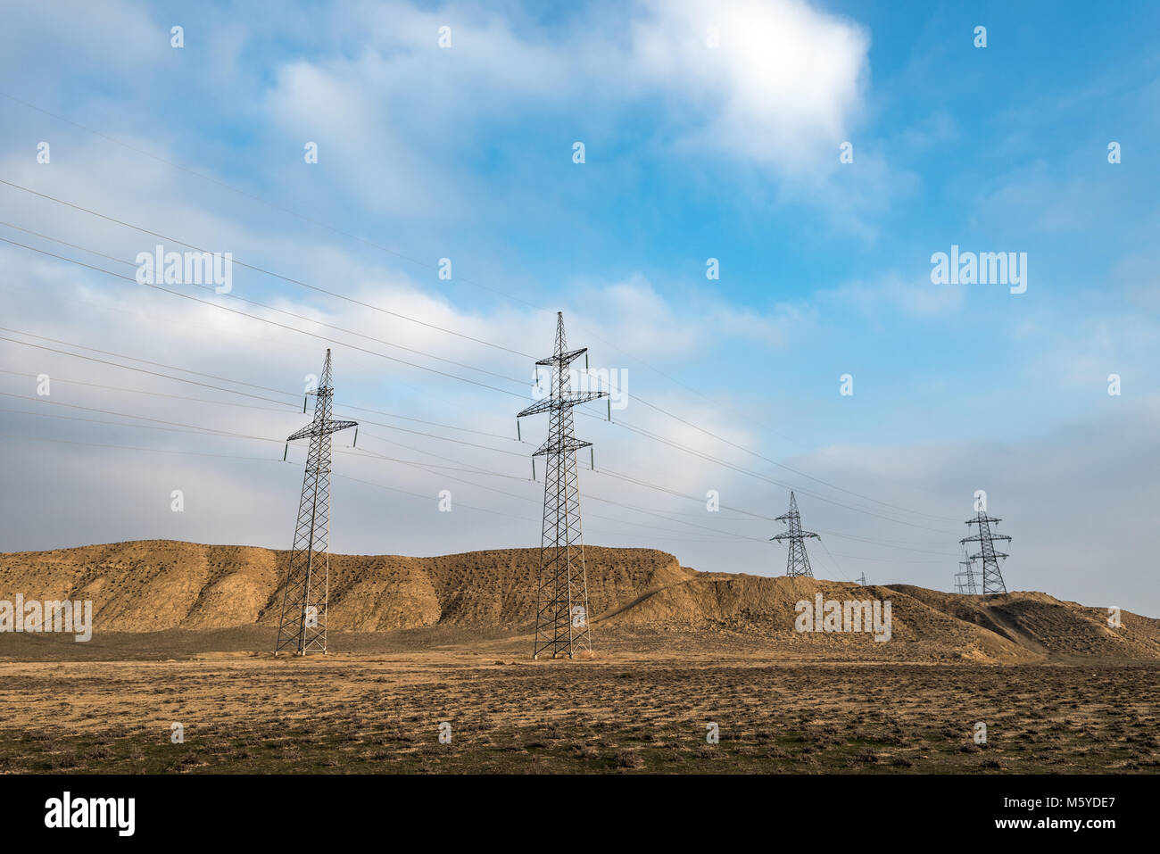 Supports of high voltage power lines Stock Photo