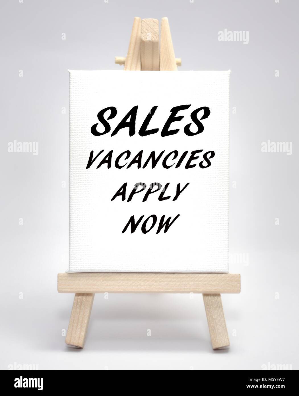 Sales vacancies apply now concept white canvas artist easel Stock Photo