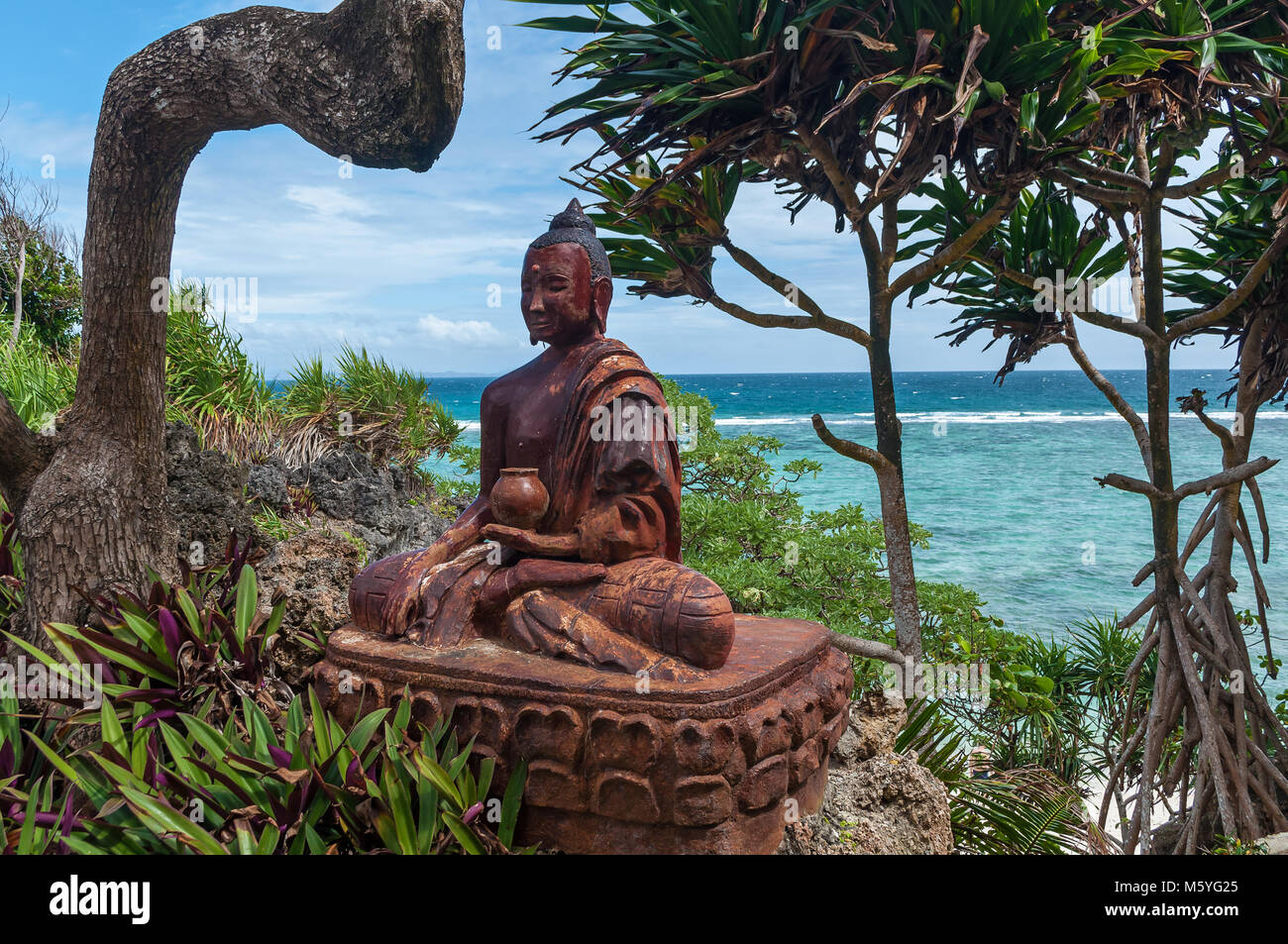Buddha statue among nature on the coast of the South China Sea Hong Kong. Buddha statue Stock Photo
