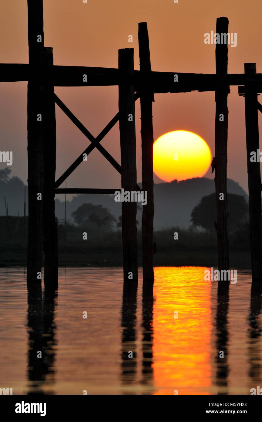 The teak U Bein Bridge in Amarapura Myanmar during sunset with monks ...
