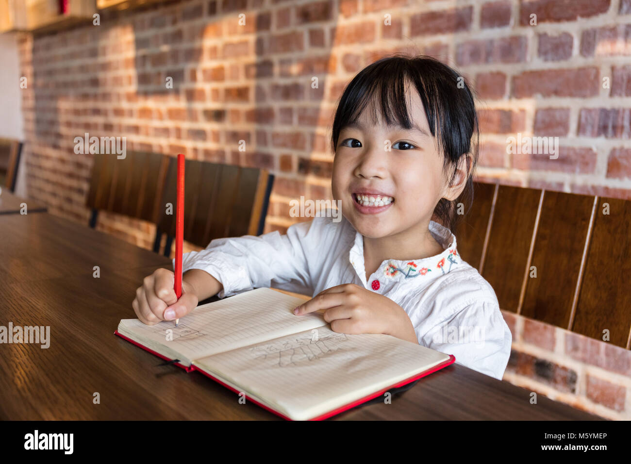 chinese restaurant kid doing homework